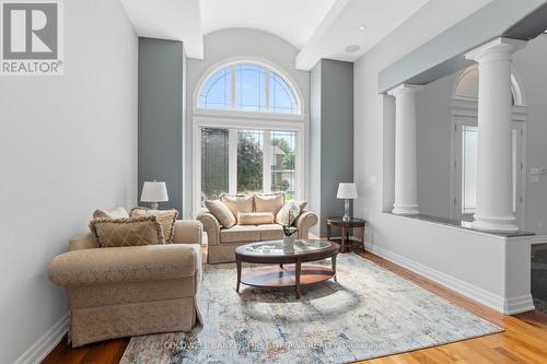 Living room w Roman style pillars & huge window. - 1623 Claymor Avenue, Ottawa, ON - Indoor Photo Showing Living Room