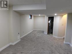 REC ROOM WITH DOOR TO FURNACE/WORK ROOM - 