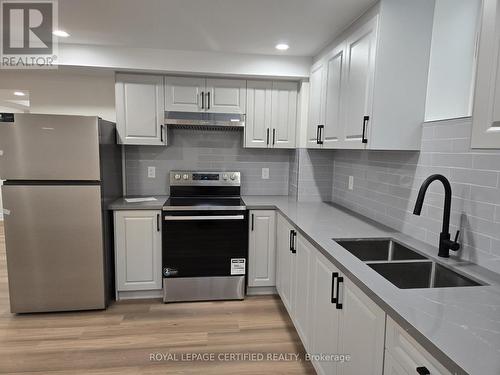 Basement - 974 Seivert Place, Milton, ON - Indoor Photo Showing Kitchen With Double Sink