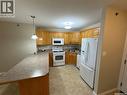 402 2909 Arens Road E, Regina, SK  - Indoor Photo Showing Kitchen With Double Sink 