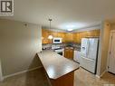 402 2909 Arens Road E, Regina, SK  - Indoor Photo Showing Kitchen With Double Sink 