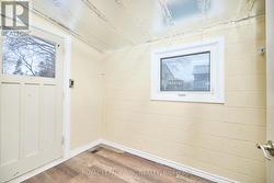 The mud room with back entrance. - 