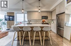 kitchen with oversized custom island/quartz top - 