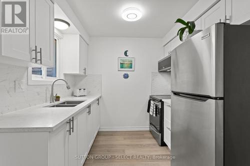 64 - 40 Tiffany Drive, London East (East I), ON - Indoor Photo Showing Kitchen With Double Sink