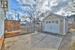 One car garage with parking spot in front - 