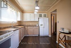 More cupboards could be added to the blank wall. - 