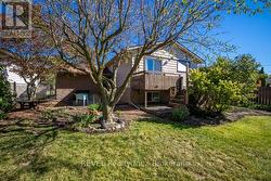 The yard is beautifully landscaped. - 