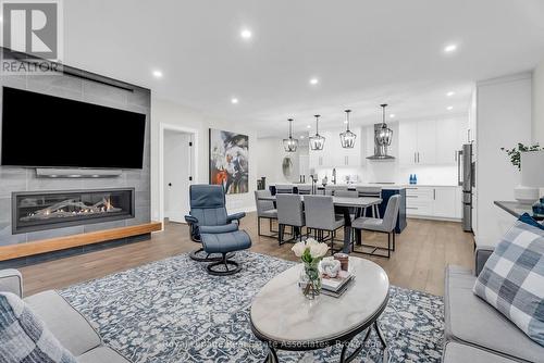 8 - 28 Juniper Trail, Welland, ON - Indoor Photo Showing Living Room With Fireplace