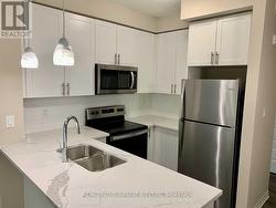 302 - 610 FARMSTEAD DRIVE  Milton, ON L9T 8X5