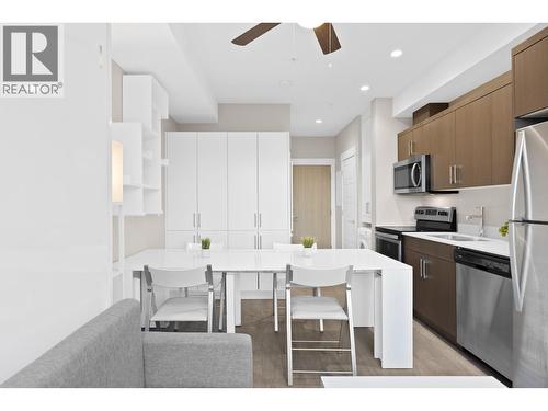 Expandable table/desk - 925 Leon Avenue Unit# 430, Kelowna, BC - Indoor Photo Showing Kitchen With Stainless Steel Kitchen With Upgraded Kitchen