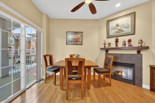 109-456 Mcphee Street, Kelowna, BC - Indoor Photo Showing Dining Room With Fireplace