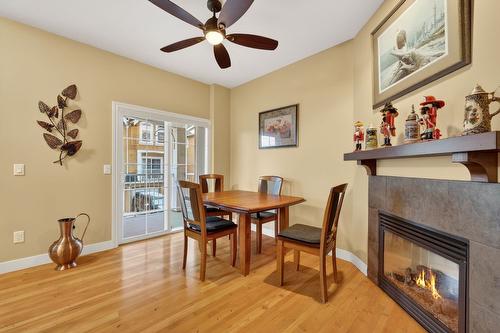 109-456 Mcphee Street, Kelowna, BC - Indoor Photo Showing Dining Room With Fireplace