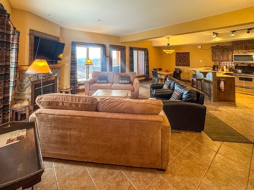 G4-B-1351 Gerry Sorensen Way, Kimberley, BC - Indoor Photo Showing Living Room With Fireplace