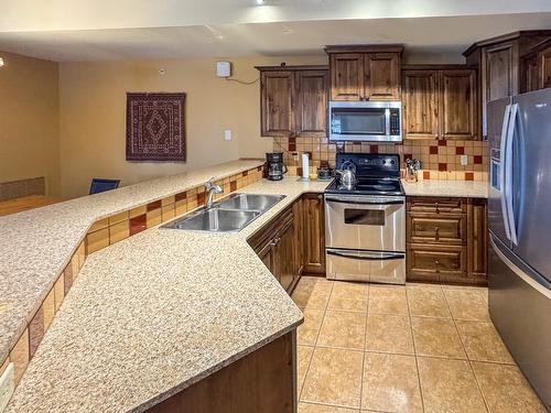 G4-A-1351 Gerry Sorensen Way, Kimberley, BC - Indoor Photo Showing Kitchen With Double Sink