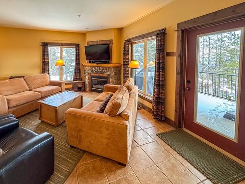 G4-A-1351 Gerry Sorensen Way, Kimberley, BC - Indoor Photo Showing Living Room With Fireplace
