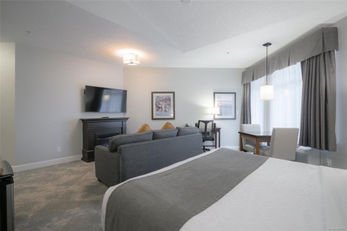 310D-1730 Riverside Lane, Courtenay, BC - Indoor Photo Showing Bedroom With Fireplace