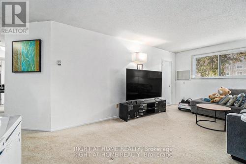 107 - 318 Lorry Greenberg Drive, Ottawa, ON - Indoor Photo Showing Living Room