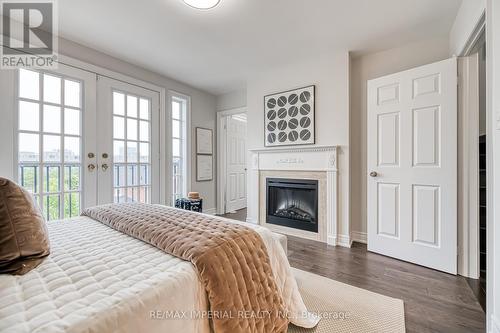 21 Mackenzie'S Stand Avenue, Markham, ON - Indoor Photo Showing Bedroom With Fireplace