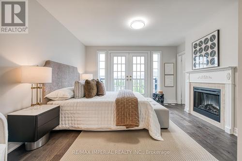 21 Mackenzie'S Stand Avenue, Markham, ON - Indoor Photo Showing Bedroom With Fireplace