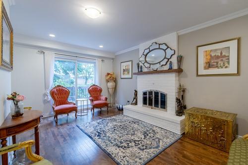 Salle familiale - 990 Rue Renoir, Brossard, QC - Indoor Photo Showing Living Room With Fireplace