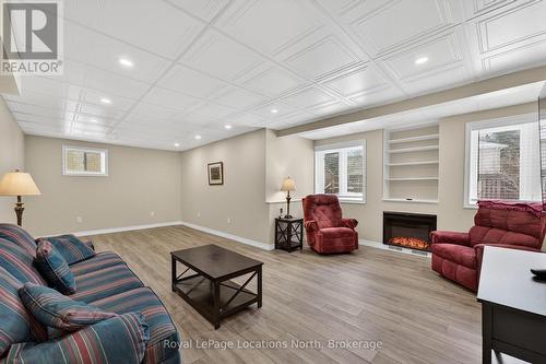 Large family room w/ fireplace - 15 Princess Point Drive, Wasaga Beach, ON - Indoor With Fireplace