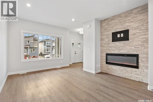 3160 Green Turtle Road, Regina, SK - Indoor Photo Showing Living Room With Fireplace