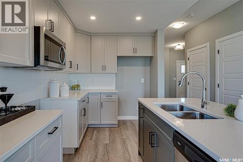 108 Traeger Common, Saskatoon, SK - Indoor Photo Showing Kitchen With Double Sink
