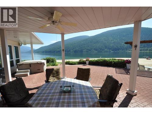 Covered patio - 2194 3A Highway, Nelson, BC - Outdoor With Body Of Water With Deck Patio Veranda With Exterior