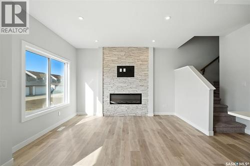 520 Myles Heidt Manor, Saskatoon, SK - Indoor Photo Showing Living Room With Fireplace