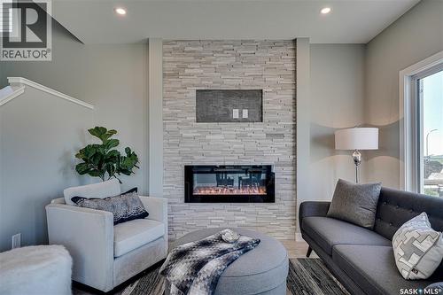 947 Traeger Manor, Saskatoon, SK - Indoor Photo Showing Living Room With Fireplace