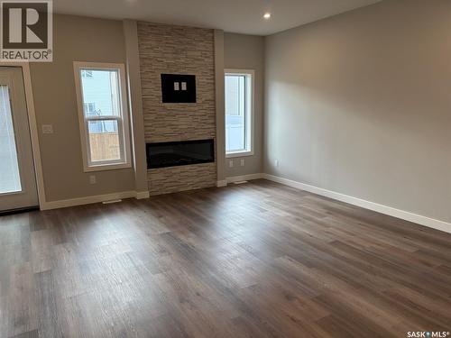 955 Traeger Manor, Saskatoon, SK - Indoor Photo Showing Living Room With Fireplace