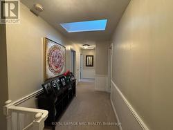Upper Hallway w/Skylight - 