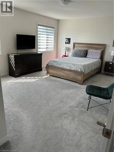 Bedroom with carpet and a textured ceiling - 49 Eberhardt Drive, Wasaga Beach, ON - Indoor Photo Showing Bedroom
