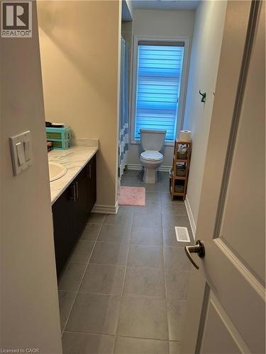 Full bath featuring vanity, light tile patterned floors, and curtained shower - 49 Eberhardt Drive, Wasaga Beach, ON - Indoor Photo Showing Bathroom
