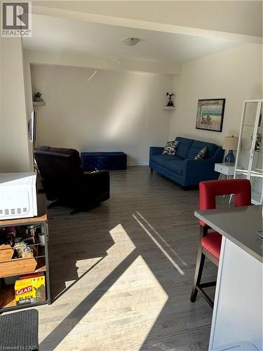 Living area featuring wood finished floors - 49 Eberhardt Drive, Wasaga Beach, ON - Indoor