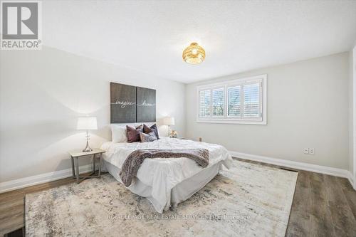 The Primary Bedroom Features a Walk-In Closet - 137 - 1520 Lancaster Drive, Oakville, ON - Indoor Photo Showing Bedroom