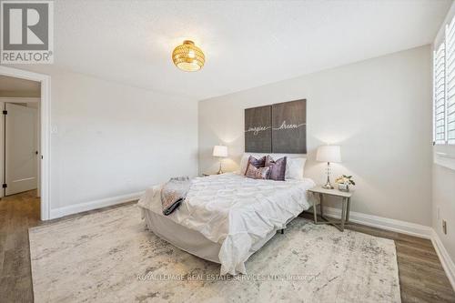The Primary Bedroom Features a Walk-In Closet - 137 - 1520 Lancaster Drive, Oakville, ON - Indoor Photo Showing Bedroom
