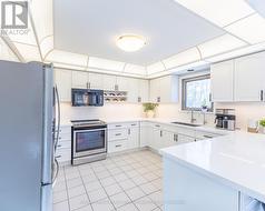 The Updated Kitchen Features Quartz Countertops - 