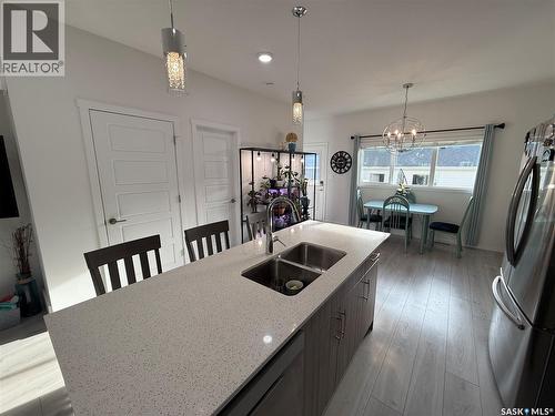 4226 Brighton Circle, Saskatoon, SK - Indoor Photo Showing Kitchen With Double Sink