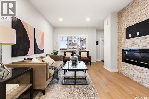 3136 Green Turtle Road, Regina, SK - Indoor Photo Showing Living Room With Fireplace