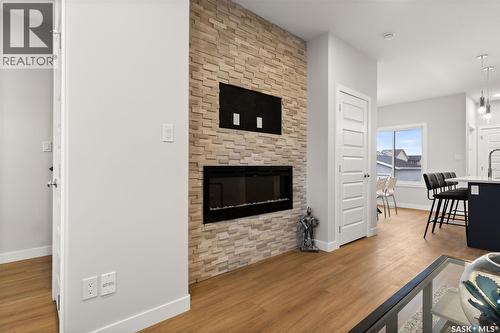 3136 Green Turtle Road, Regina, SK - Indoor Photo Showing Living Room With Fireplace