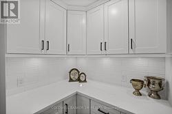 Pantry with Counters, Tile Backsplash & Counters. - 