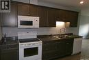 307 923 Kristjanson Road, Saskatoon, SK  - Indoor Photo Showing Kitchen With Double Sink 