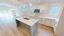 B-353 Legacy Lookout, Cranbrook, BC  - Indoor Photo Showing Kitchen With Double Sink With Upgraded Kitchen 