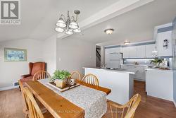 a dining area overlooking the water - 