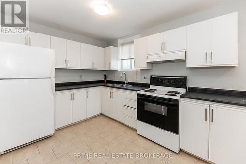 219 Emerson Avenue, London South (South H), ON - Indoor Photo Showing Kitchen With Double Sink
