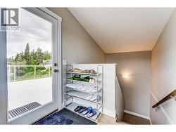 Entry way to roof top patio with plenty of space for shoes, robes, and hot tub supplies. - 