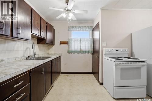4708 4Th Avenue, Regina, SK - Indoor Photo Showing Kitchen With Double Sink