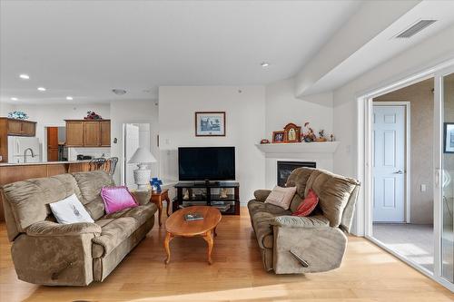 408-1961 Durnin Road, Kelowna, BC - Indoor Photo Showing Living Room With Fireplace