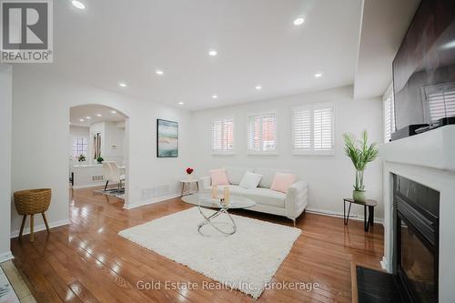 1627 Samuelson Circle, Mississauga, ON - Indoor Photo Showing Living Room With Fireplace